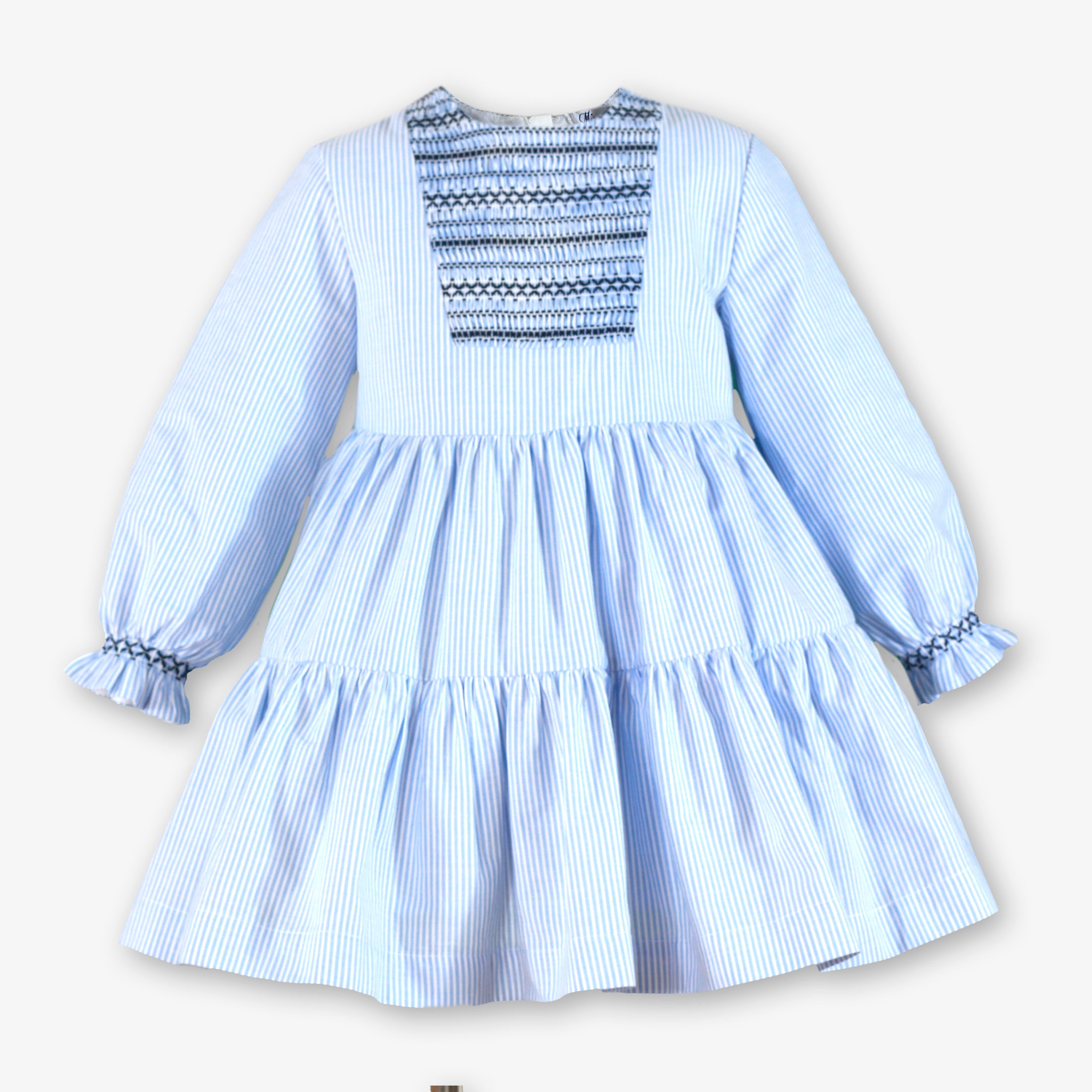 Vestido de invierno para niña a rayas azul celeste con pechera en nido de abeja marino y falda de volantes - Miranda 40/0244/V
