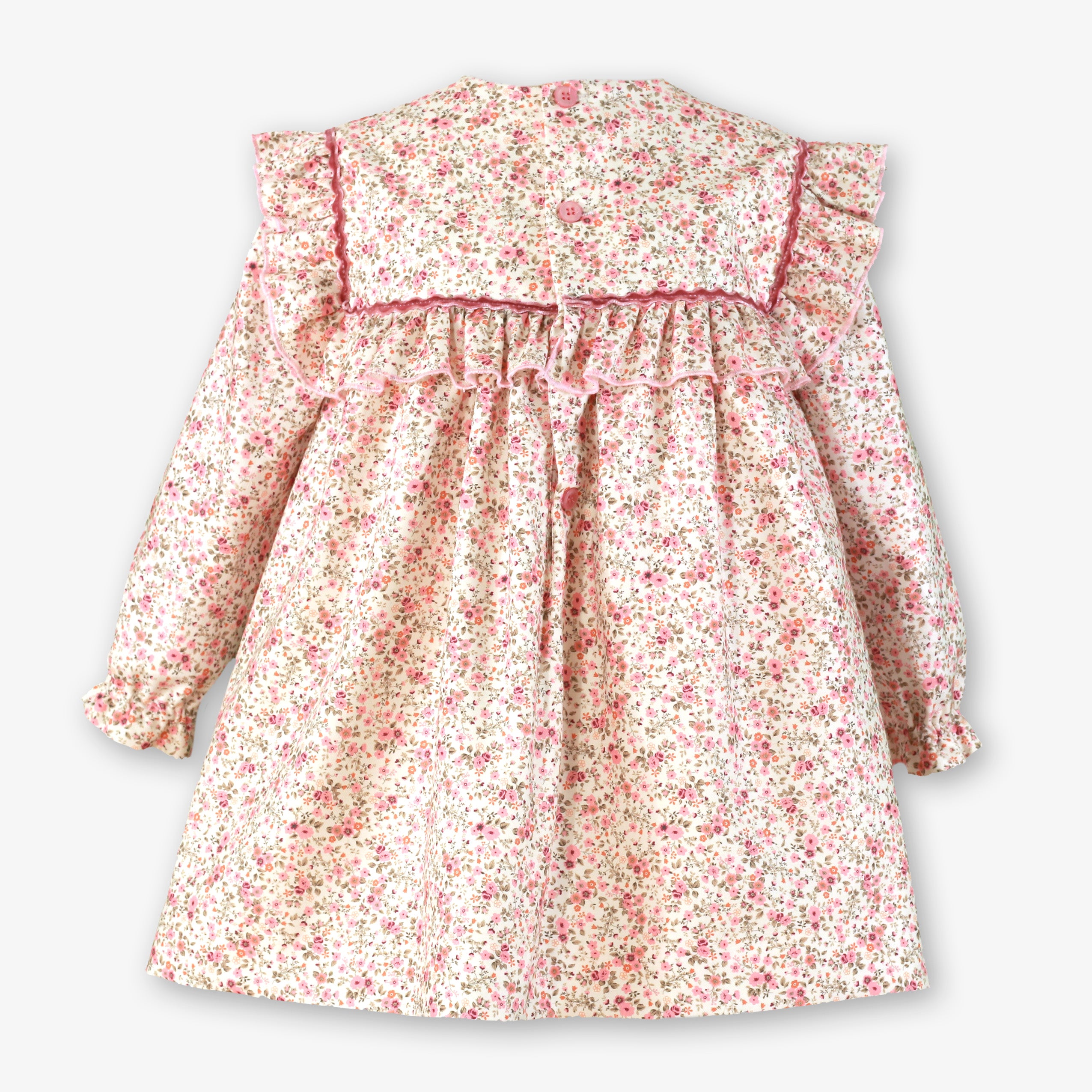 Vista trasera con botonadura del vestido floral rosa palo de niña firma Miranda