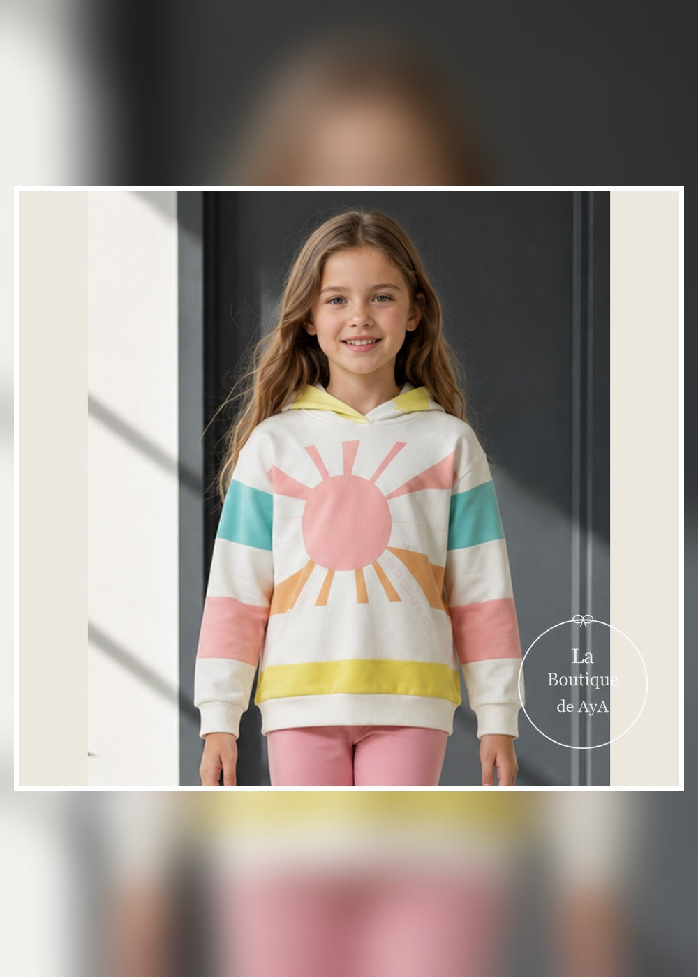 Detalle del sol y las franjas pastel de la sudadera Daisy Agatha Ruiz de la Prada