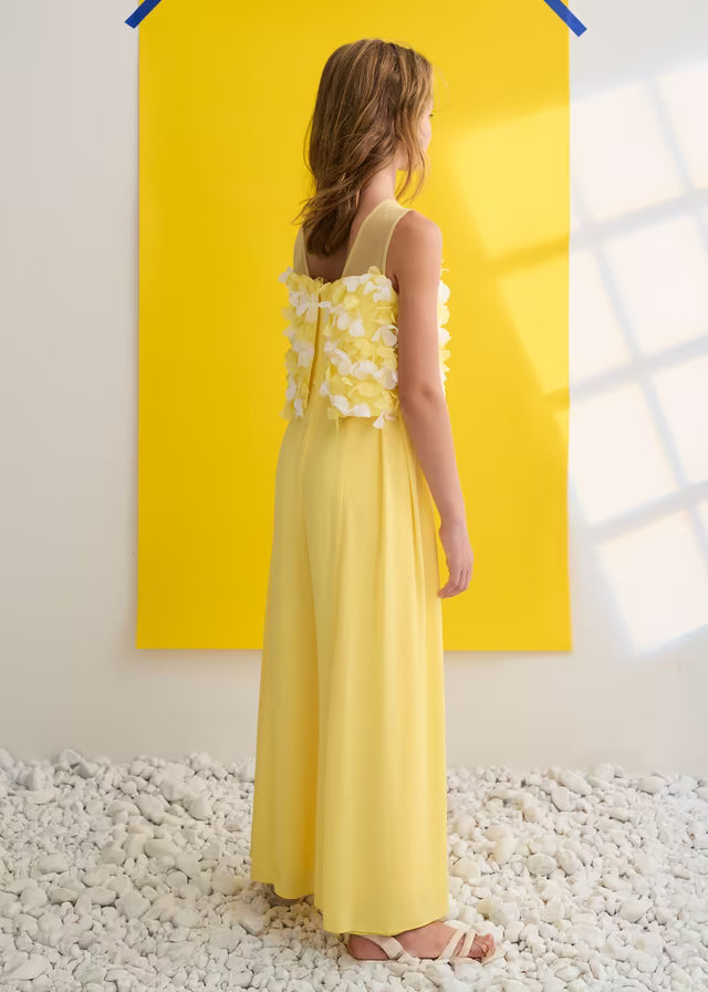 Vista trasera del mono niña amarillo con aplicaciones florales Abel y Lula