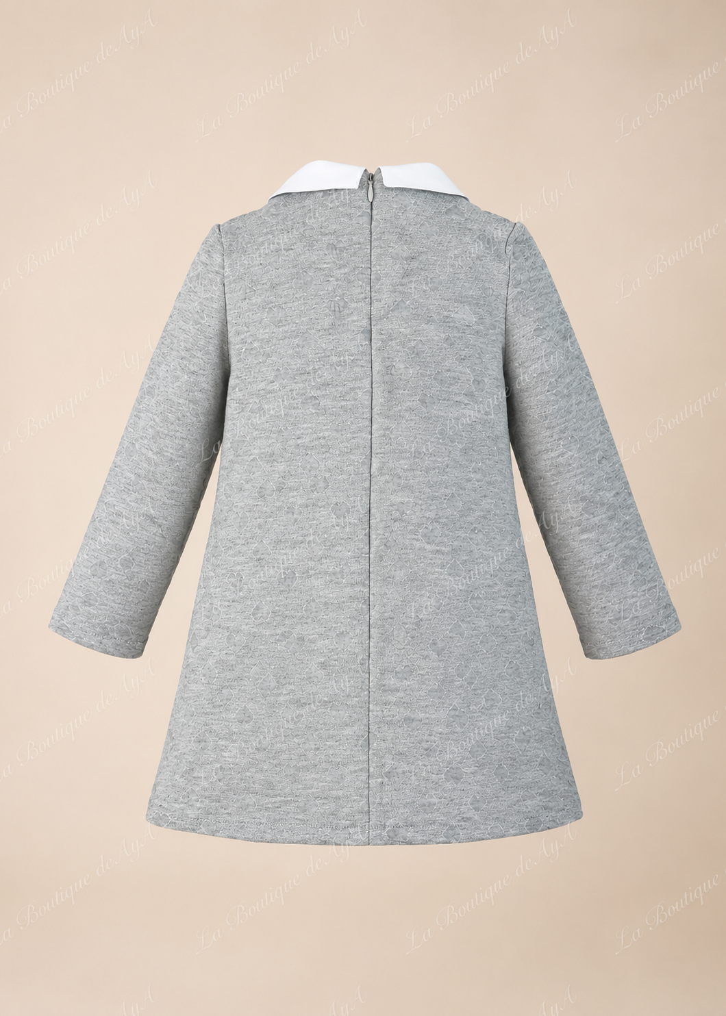 Vista trasera del vestido gris Miranda para niña con cierre de cremallera