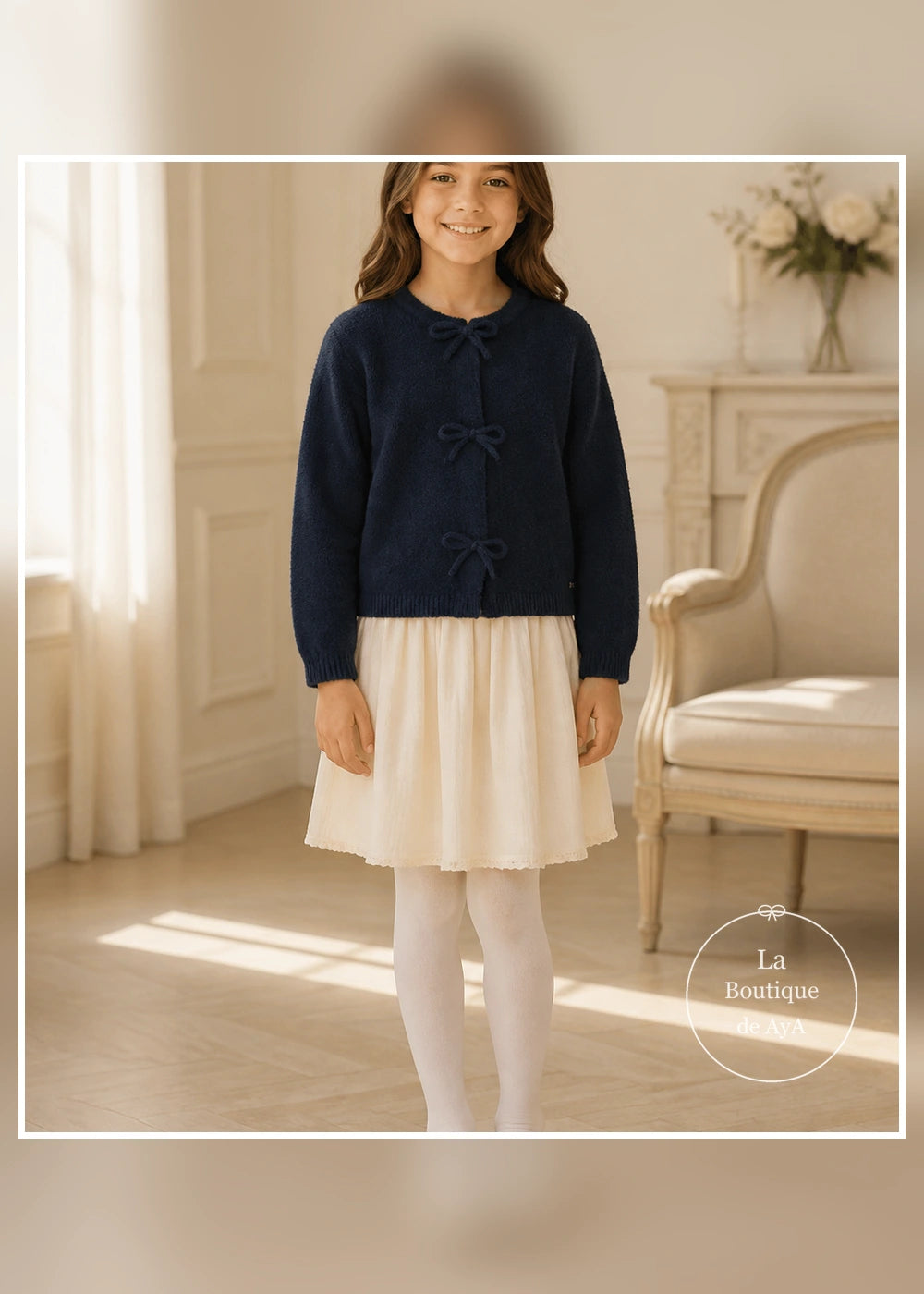 Rebeca de punto con lazos marino para niña Mayoral 04325-097 - modelo