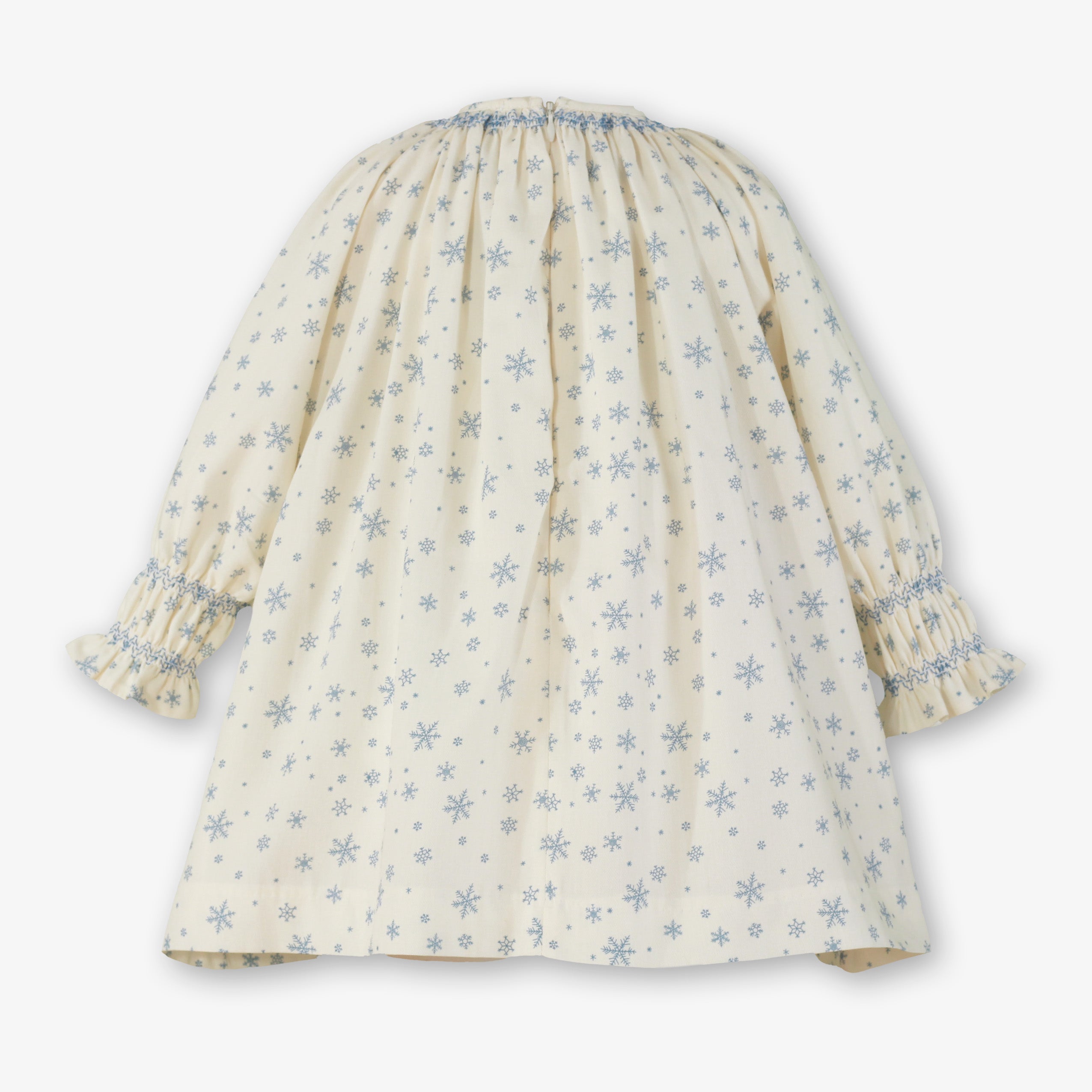 Vista posterior con vuelo y cierre invisible del vestido crudo de invierno para niña marca Miranda