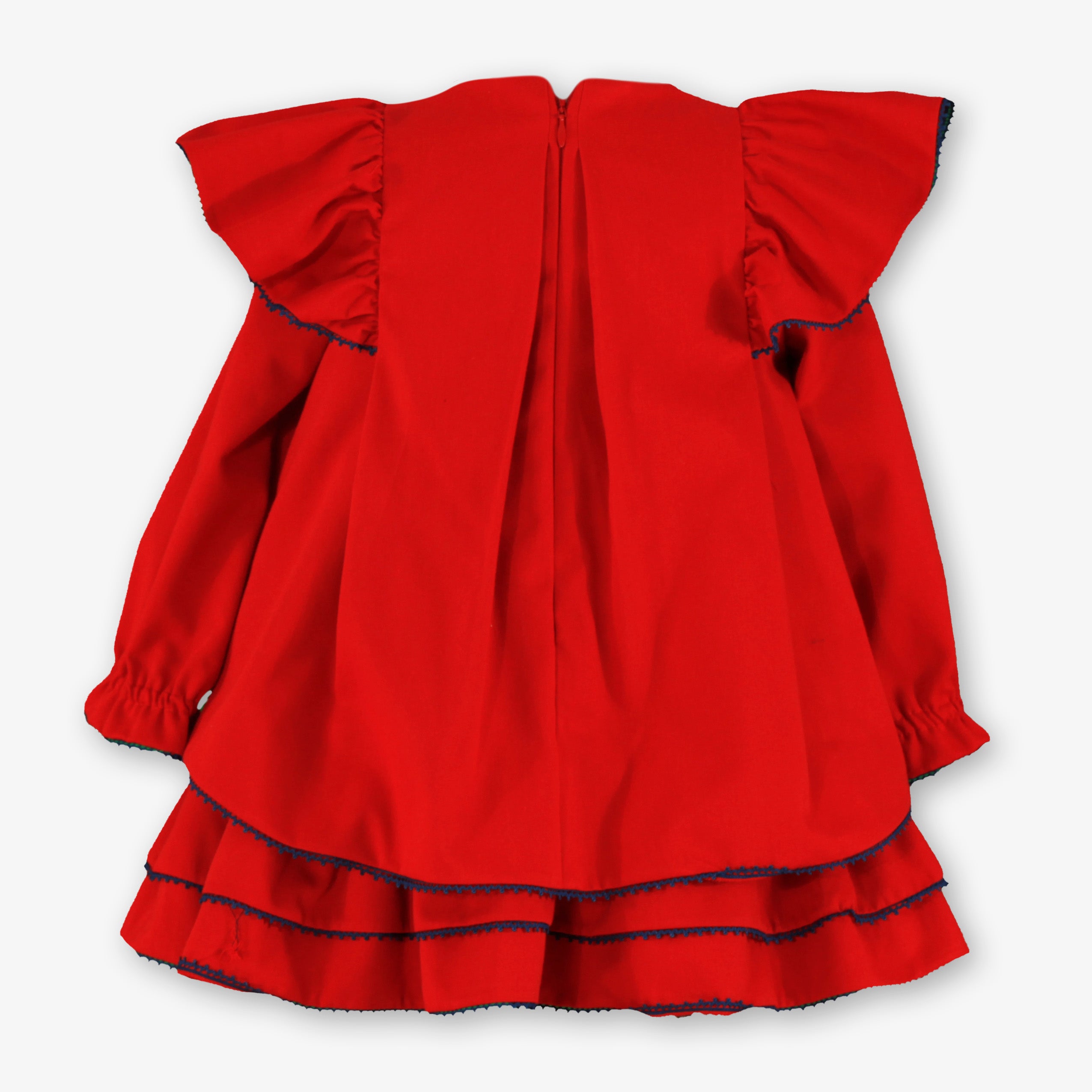 Vista trasera con cremallera y corte en capas del vestido rojo de vestir para niña marca Miranda