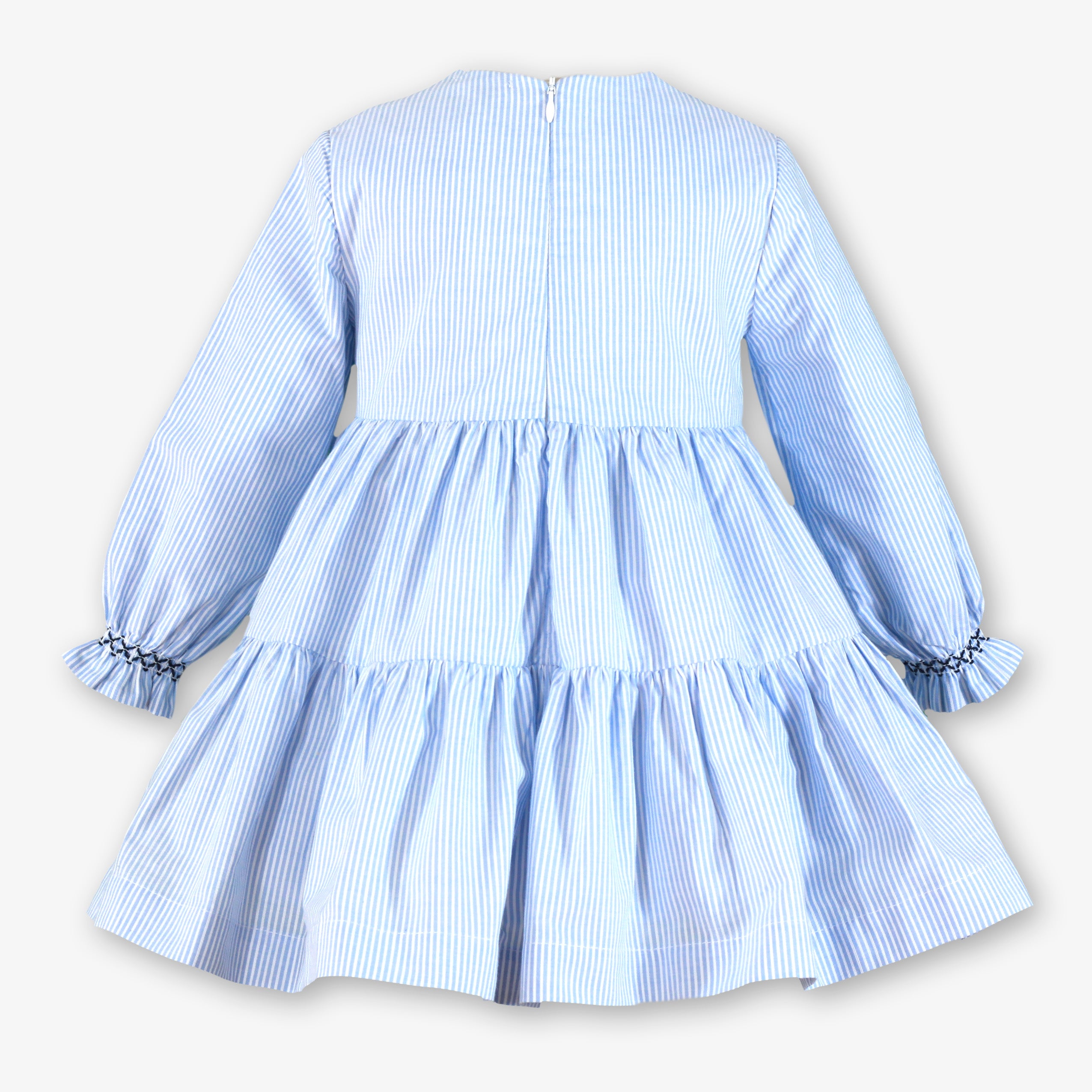 Vista trasera con cremallera invisible del vestido a rayas azul celeste para niña firma Miranda