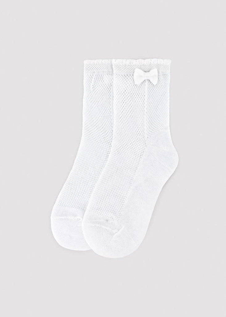 Calcetín calado blanco para niña con lazo lateral y puño antipresión marca Ysabel Mora para eventos y ceremonia.