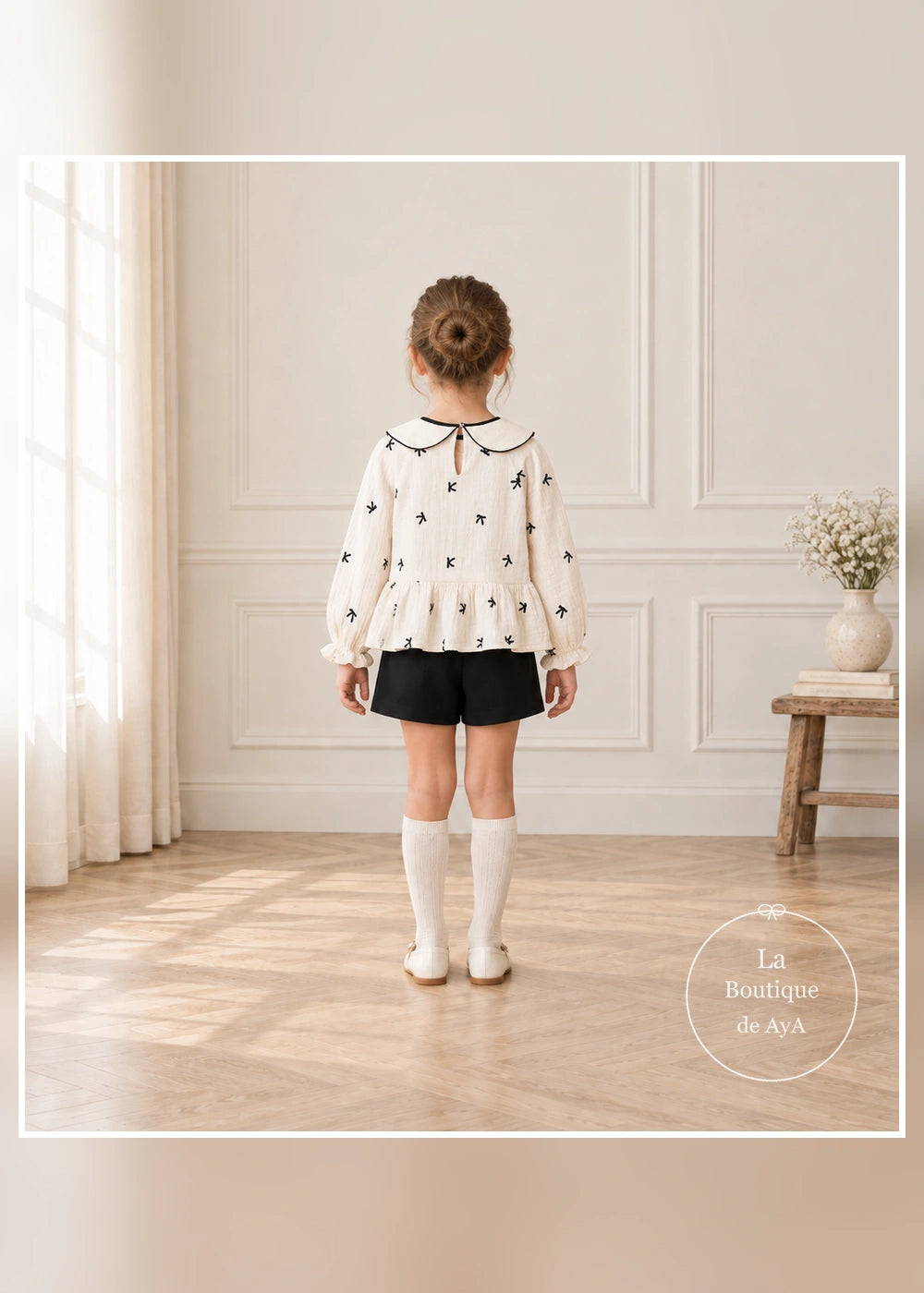Conjunto de blusa de lazos y falda pantalón negra para niña Mayoral, vista trasera