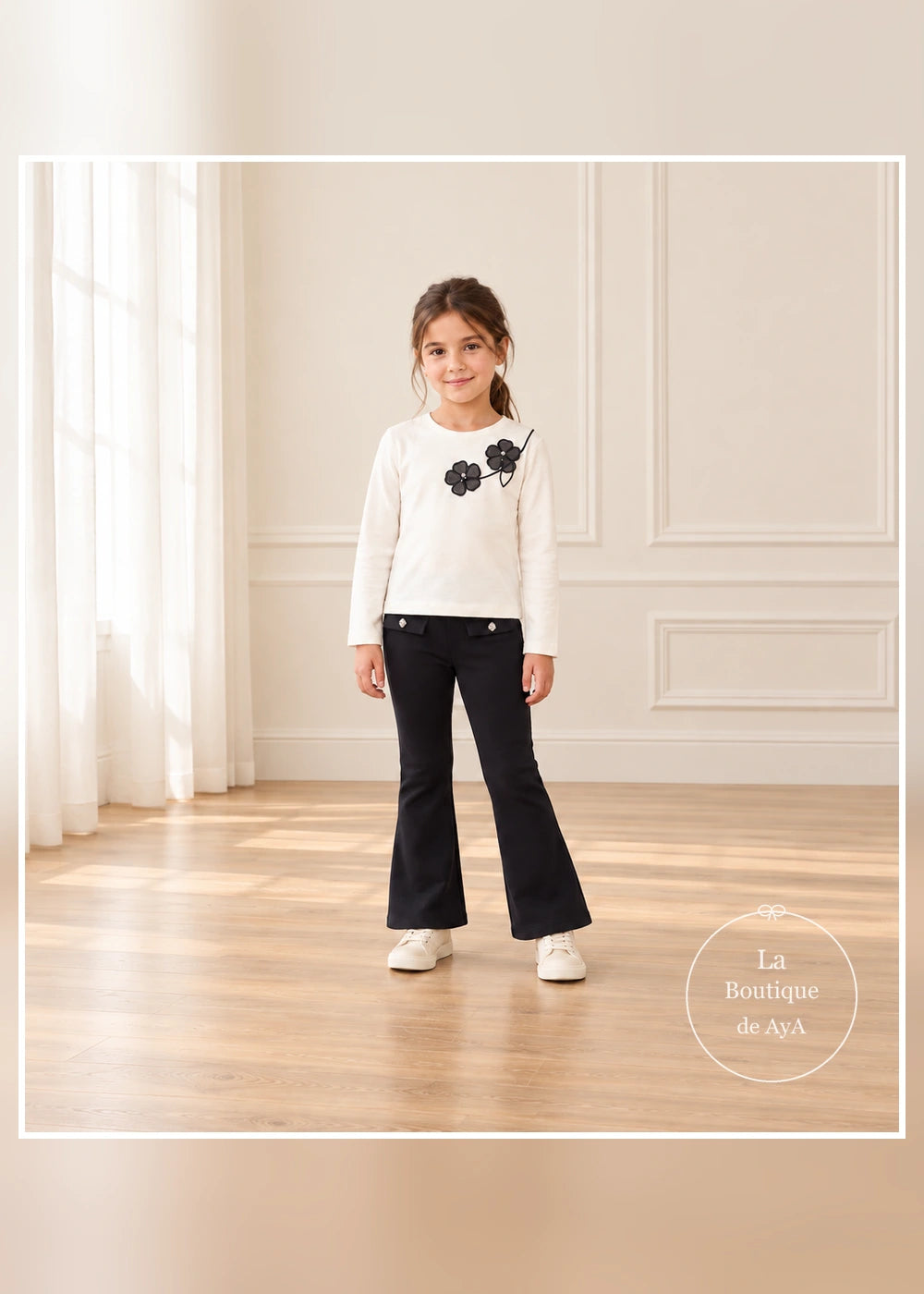 Conjunto de camiseta de flores y leggings flare negros para niña Mayoral, vista frontal