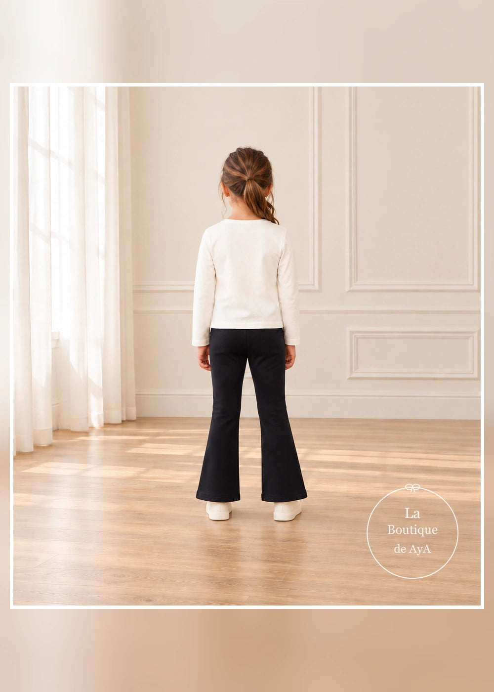 Conjunto de camiseta de flores y leggings flare negros para niña Mayoral, vista trasera